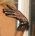 Lace wrist length gloves w/ ruffle trim.